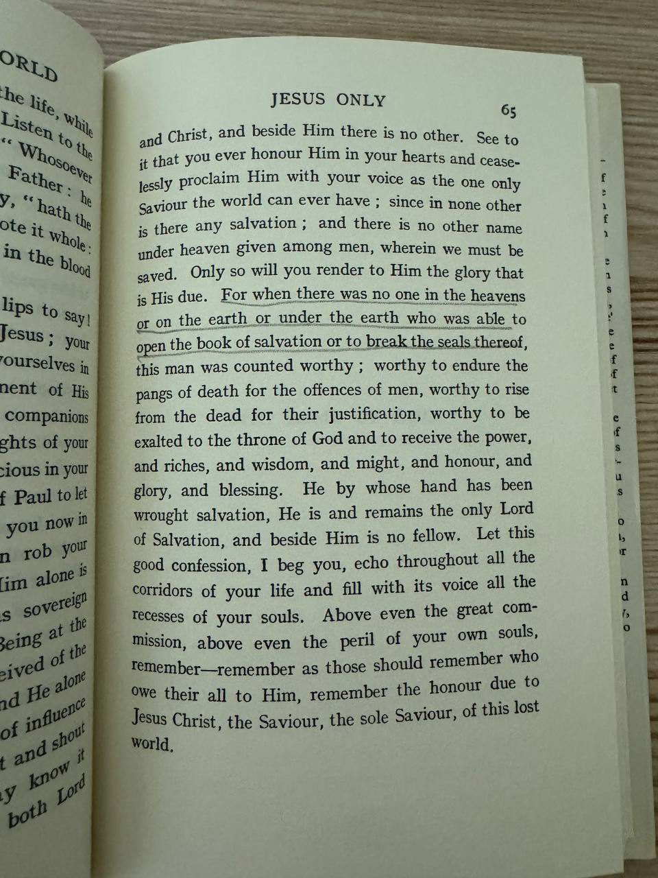 開いた本の65ページ「JESUS ONLY」の章。「there is no other name under heaven given among men, wherein we must be saved」と続く本文の一部に、鉛筆で下線が引かれている